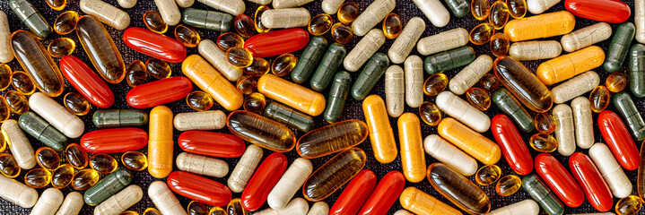 multivitamin dietary supplements banner. dietary supplements top view. mental wellbeing and personal health concept