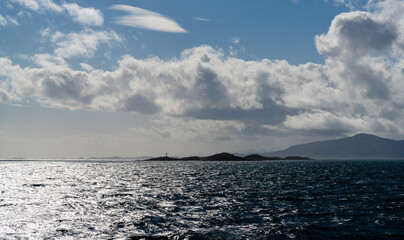 ocean view with Hjertholmen Island and the Lofoten Islands of northern Norway