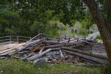picturesque view of wooden broken bridge near forest at summer day 