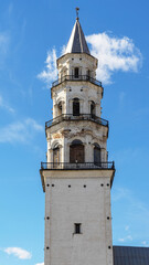 Fototapeta na wymiar Leaning Tower of Nevyansk in summer day. The top and tiers of tower in the town of Nevyansk in Sverdlovsk Oblast, Russia. Close up.