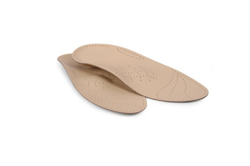 Isolated orthopedic insole on a white background. Treatment and prevention of flat feet and foot diseases. Foot care, comfort for the feet. Wear comfortable shoes. Medical insoles.