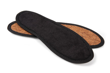 Isolated orthopedic insole on a white background. Treatment and prevention of flat feet and foot diseases. Foot care, comfort for the feet. Wear comfortable shoes. Medical insoles.