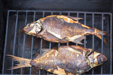 Roasted river fish on the grill, Tasty homemade roasted perches in grill pan, flat lay. River fish