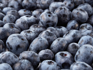 Blueberry fruit top view isolated on a white background, flat lay overhead layout with mint leaf, healthy design concept.