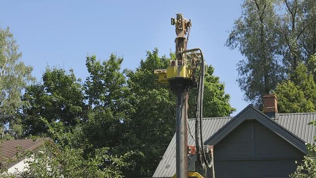 Drilling in ground an artesian well for groundwater. Mud shooting out of tube. Clean water supply. Slow motion