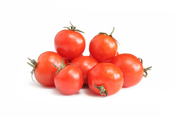 Pile of shiny cherry tomatoes isolated on white background