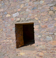 Window in a stone wall of Bhangarh fort in Rajasthan, India