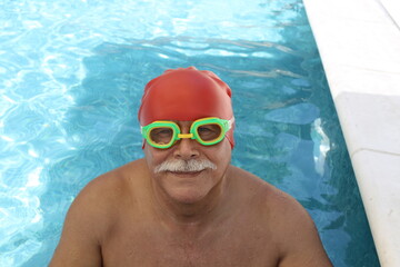 Senior male swimmer working out 