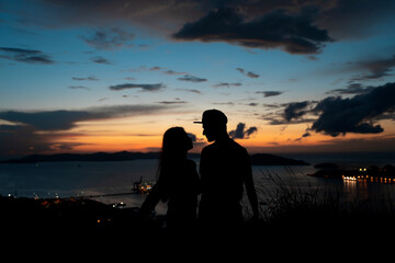 Fototapeta na wymiar Silhouette of couple during sunset