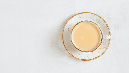 Latte coffee. Cappuccino on a white concrete background. Indian masala chai tea. Copy space, top...