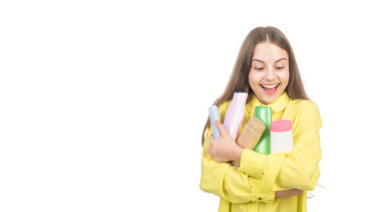 happy teen girl presenting shampoo conditioner bottle isolated on white copy space, advisor.