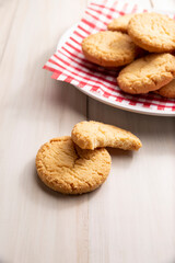 Homemade crunchy cookies on a white wooden rustic table