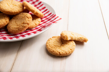 Close up image of Homemade crunchy cookies on white  wooden rustic table