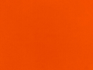 Orange velvet fabric texture used as background. Empty orange fabric background of soft and smooth textile material. There is space for text.
