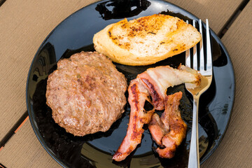 bacon and pork chops and toasted bread