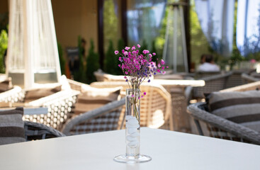 restaurant interior with a vase of flowers on the table