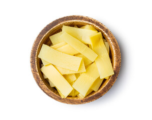 Sliced canned bamboo shoots in wooden bowl.
