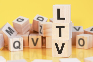 acronym LTV from wooden blocks with letters, concept