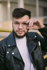 Hipster man in the city portrait wearing glasses