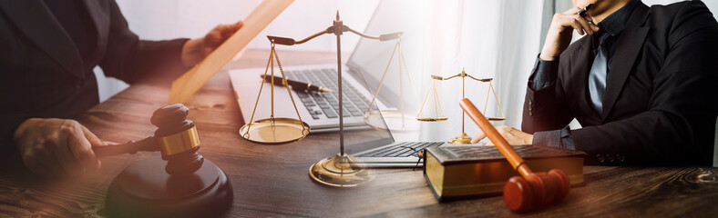 Business and lawyers discussing contract papers with brass scale on desk in office. Law, legal...