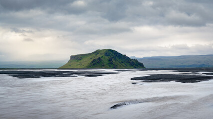 Low-angle view of large riverbed near Seljalandsfoss waterfall, Rangárþing eystra, Southern Iceland