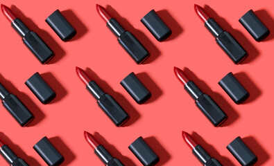 Creative pattern fashion photo of cosmetics beauty products red lipstick on a red background