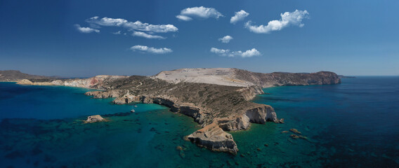 Aerial drone photo of beautiful volcanic emerald paradise bay below white rock with perlite mine, Milos island, Cyclades, Greece