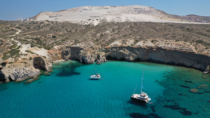 Aerial drone photo of beautiful volcanic emerald paradise bay below white rock with perlite mine, Milos island, Cyclades, Greece