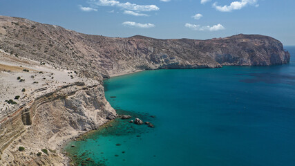 Aerial drone photo of beautiful volcanic emerald paradise bay below white rock with perlite mine, Milos island, Cyclades, Greece
