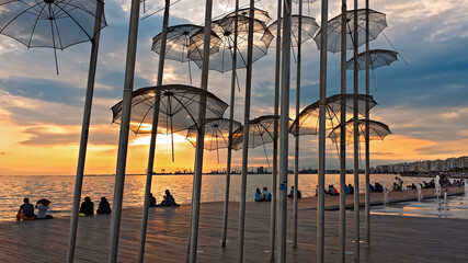 The Umbrellas, by Giorgios Zogolopoulos located at the seafront and constructed in 1997.  He was Greek sculptor which works adorn public places and official buildings. Thessaloniki, Greece, Jun 2014