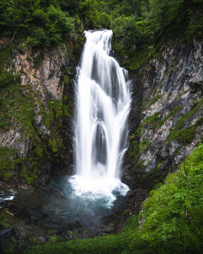 photo of mountain waterfall with water in silk effect