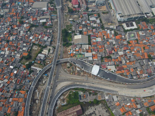 Aerial view on the new road construction site. Jakarta, Indonesia, July 28, 2021