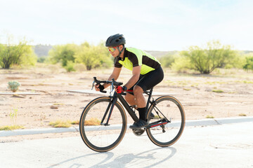 Side view of a handsome cyclist training