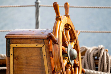 wooden ship's wheel of a tall ship