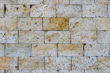 Fototapeta premium Texture of the limestone bricks for background. Natural pattern