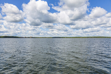 Beautiful natural summer landscape with picturesque lake Senezh and cloudy sky. Moscow region, Russia