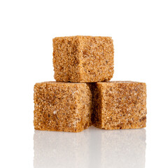 Dark sugar in cubes, special sweetness with a smaller amount, sugar from cane, isolated on a white...