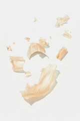 Abstraction of onion peels on white background