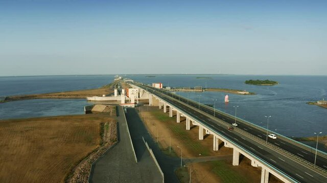 Aerial low altitude shot of a modern highway across the sea. Saint Petersburg, Russia