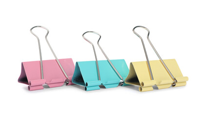 Colorful binder clips on white background. Stationery item