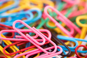 Pile of colorful paper clips macro abstract background