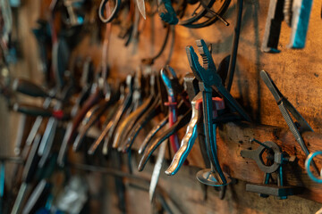Fototapeta na wymiar A lot of old rusty instruments in vintage dirty garage.