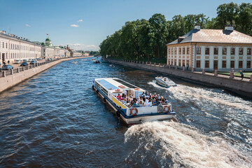 view of tourist ships on the Fontanka canal in St. Petersburg, Russia