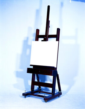 Vertical Shot Of An Easel With A Blank Canvas