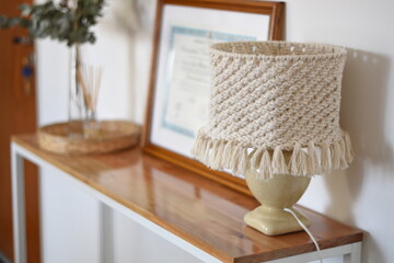 a beautiful woven woolen lamp on the table