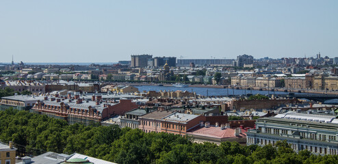 panoramic top view of the roofs of buildings in the historical part of the city and the blue sky on a sunny summer day and a copy space in Saint-Petersburg Russia