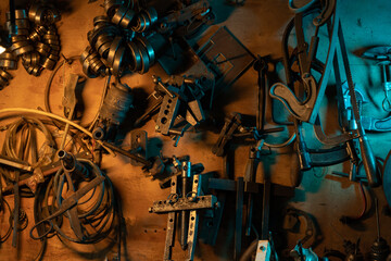 A lot of old rusty instruments in vintage dirty garage.