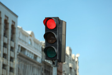 View of traffic light against blue sky