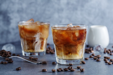 Iced coffee with ice cubes in glass