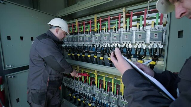 Checking the operating voltage levels of the solar panel switchgear compartment